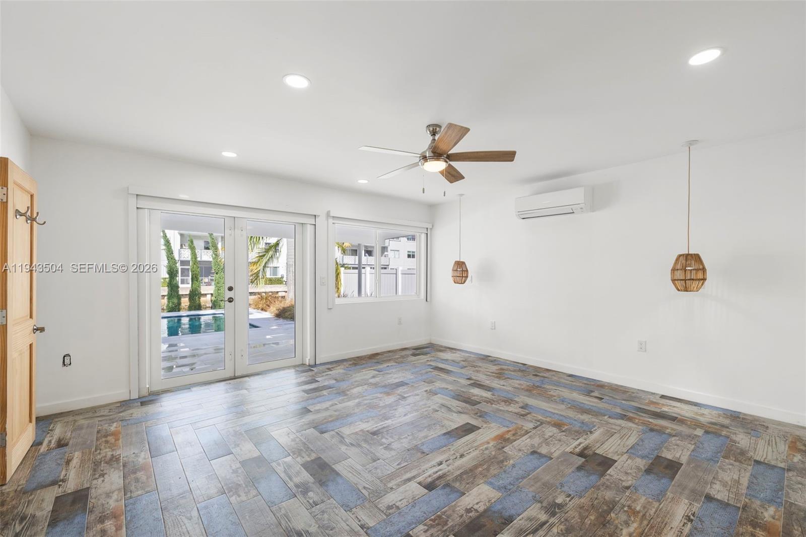 1895 Ixora Road North Miami, FL 33181 - Photo 17 of 42 a view of an empty room with a window