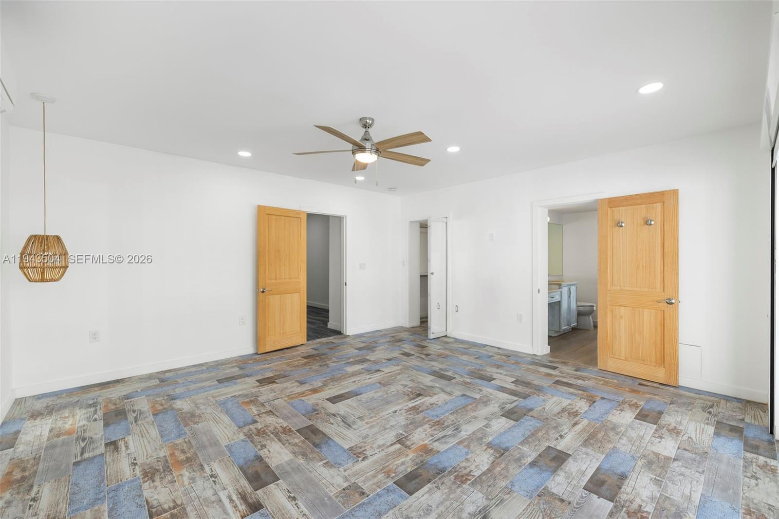 1895 Ixora Road North Miami, FL 33181 - Photo 19 of 42 a view of a livingroom with a ceiling fan and window