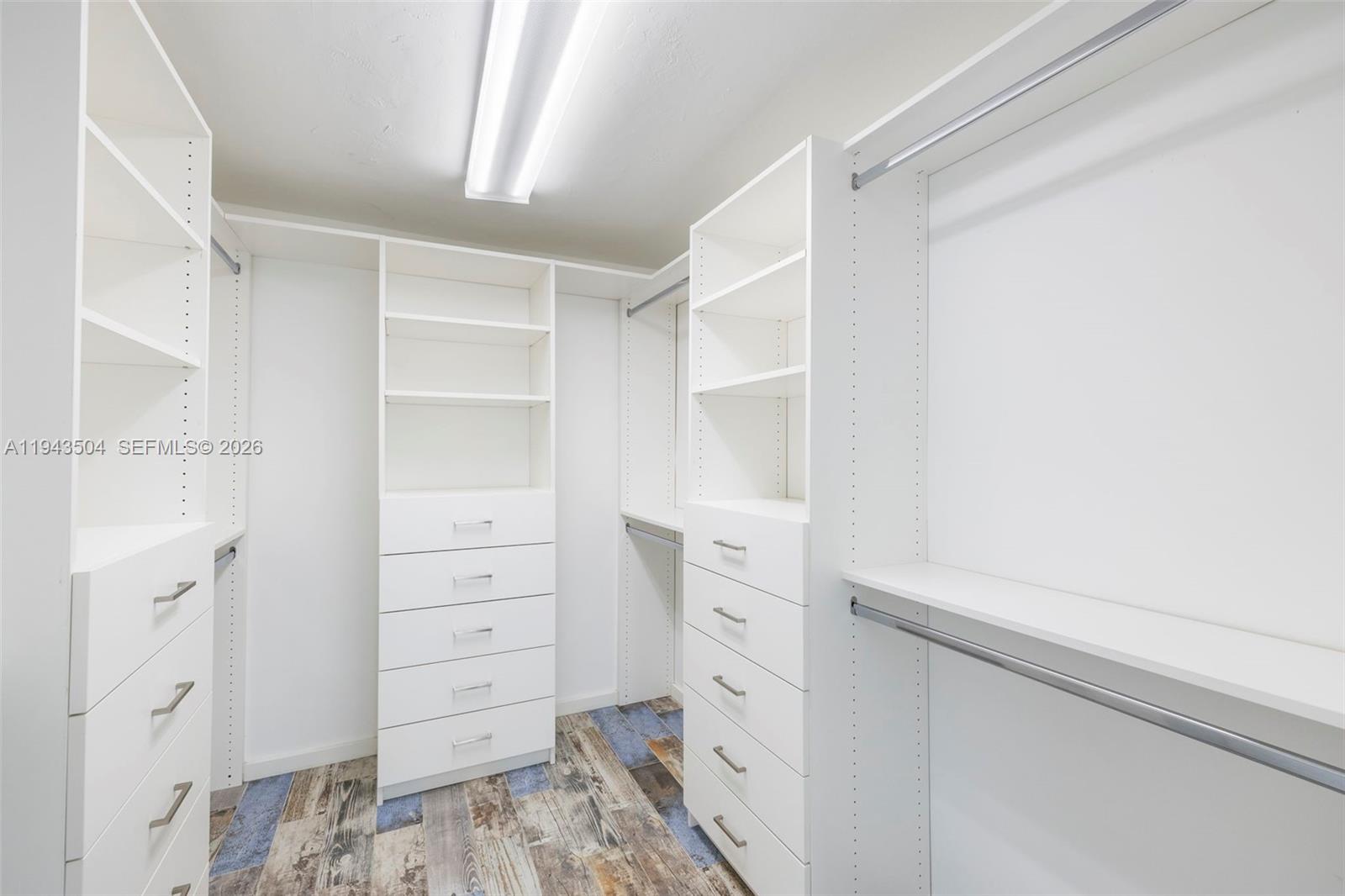 1895 Ixora Road North Miami, FL 33181 - Photo 20 of 42 a view of walk in closet with cabinet