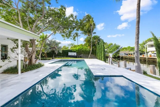 a view of a swimming pool with a patio