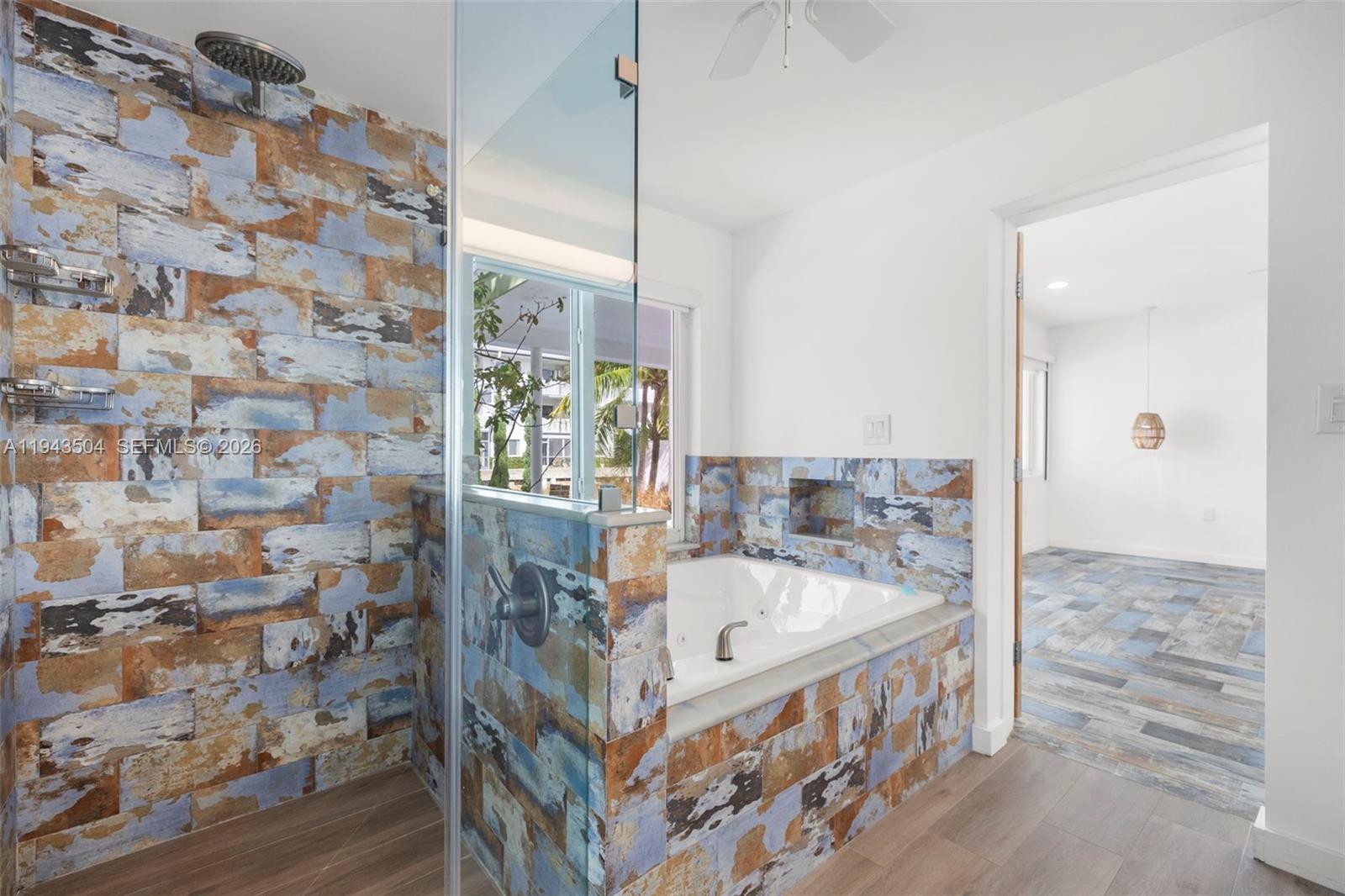 1895 Ixora Road North Miami, FL 33181 - Photo 22 of 42 a bathroom with a bathtub and shower