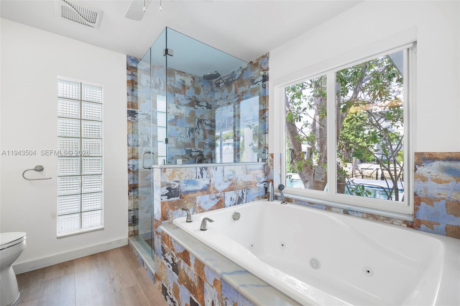 1895 Ixora Road North Miami, FL 33181 - Photo 23 of 42 a bathroom with a bathtub and a shower