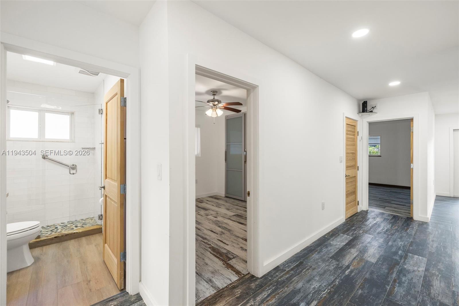 1895 Ixora Road North Miami, FL 33181 - Photo 25 of 42 a view of a hallway with wooden floor and closet
