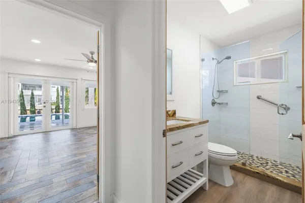 a bathroom with a sink toilet and shower