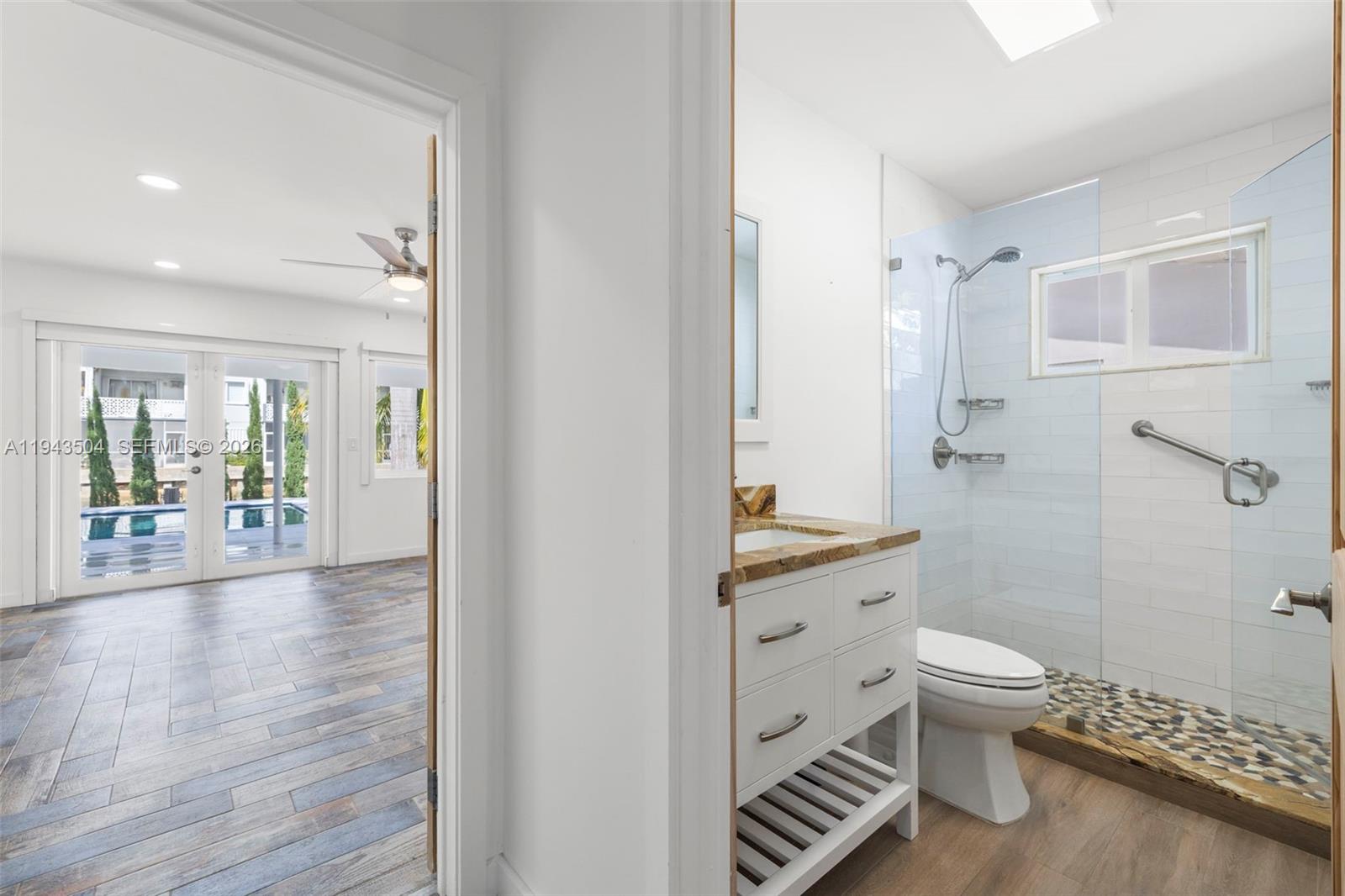 1895 Ixora Road North Miami, FL 33181 - Photo 26 of 42 a bathroom with a sink toilet and shower