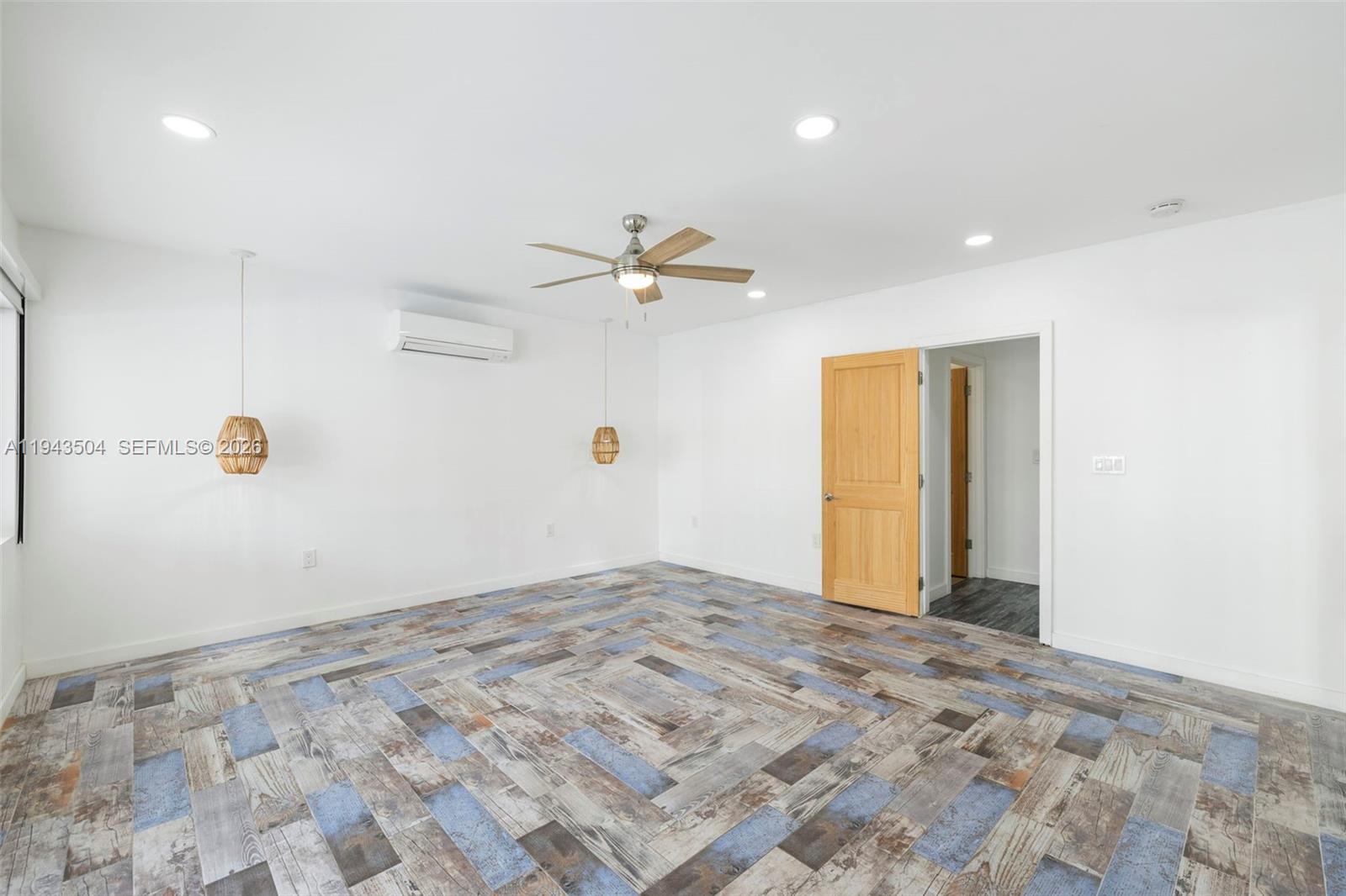 1895 Ixora Road North Miami, FL 33181 - Photo 32 of 42 a view of a livingroom with a ceiling fan and window
