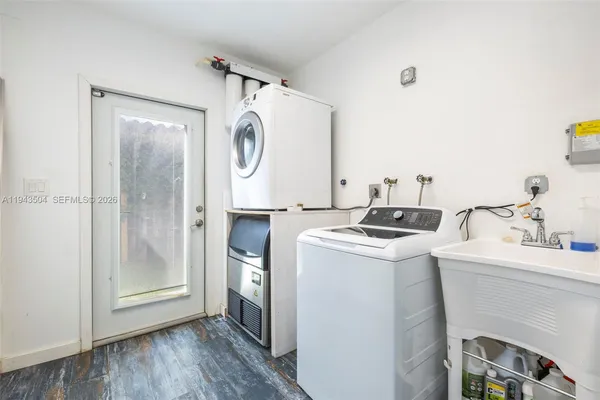 a utility room with dryer and washer