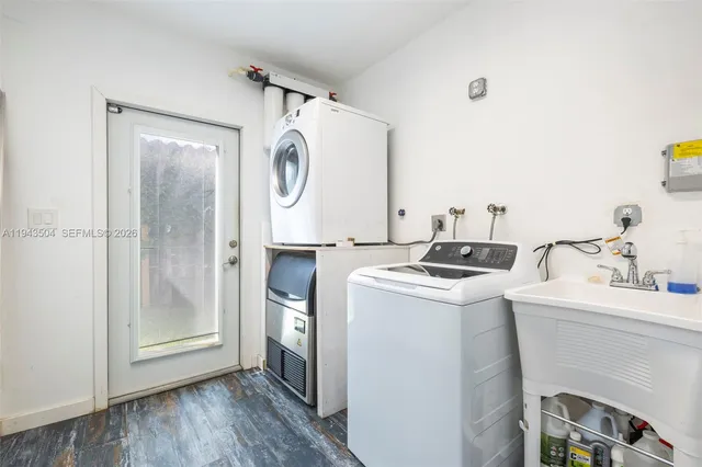 a utility room with dryer and washer