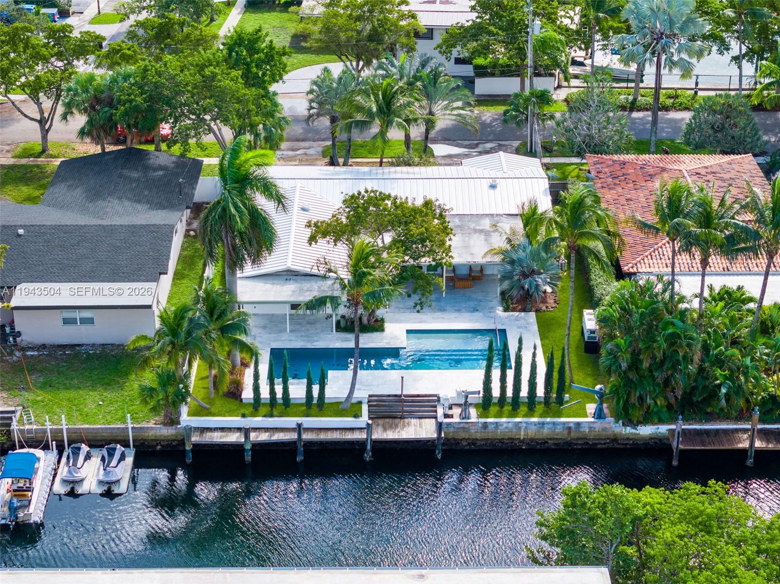 1895 Ixora Road North Miami, FL 33181 - Photo 40 of 42 an outdoor space with lots of palm trees