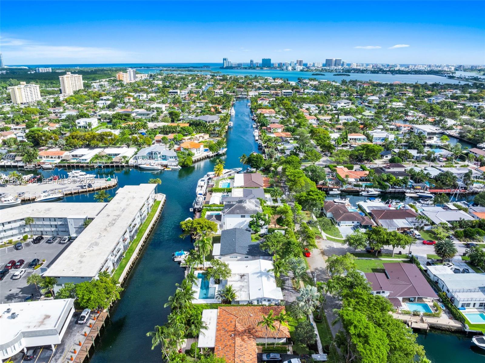 1895 Ixora Road North Miami, FL 33181 - Photo 4 of 42 an aerial view of residential houses with outdoor space and swimming pool