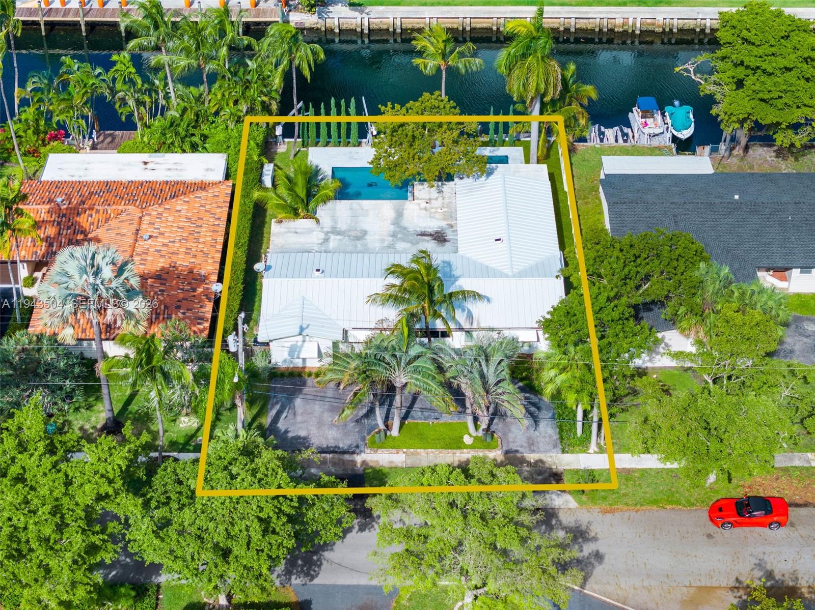 1895 Ixora Road North Miami, FL 33181 - Photo 41 of 42 an aerial view of a house with a yard basket ball court and outdoor seating
