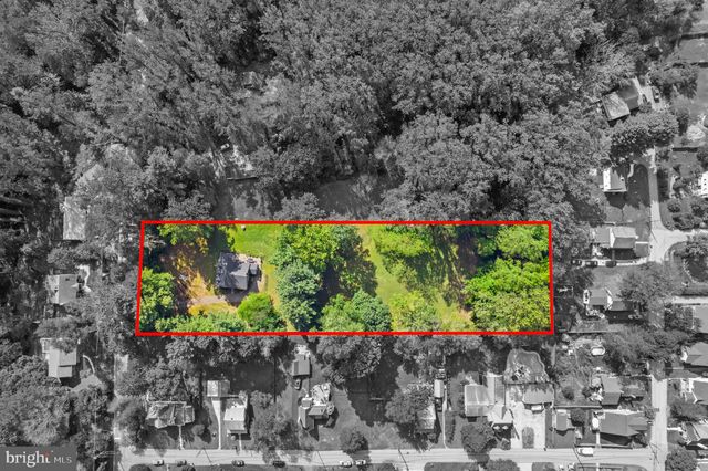 a wooden fence with some plants