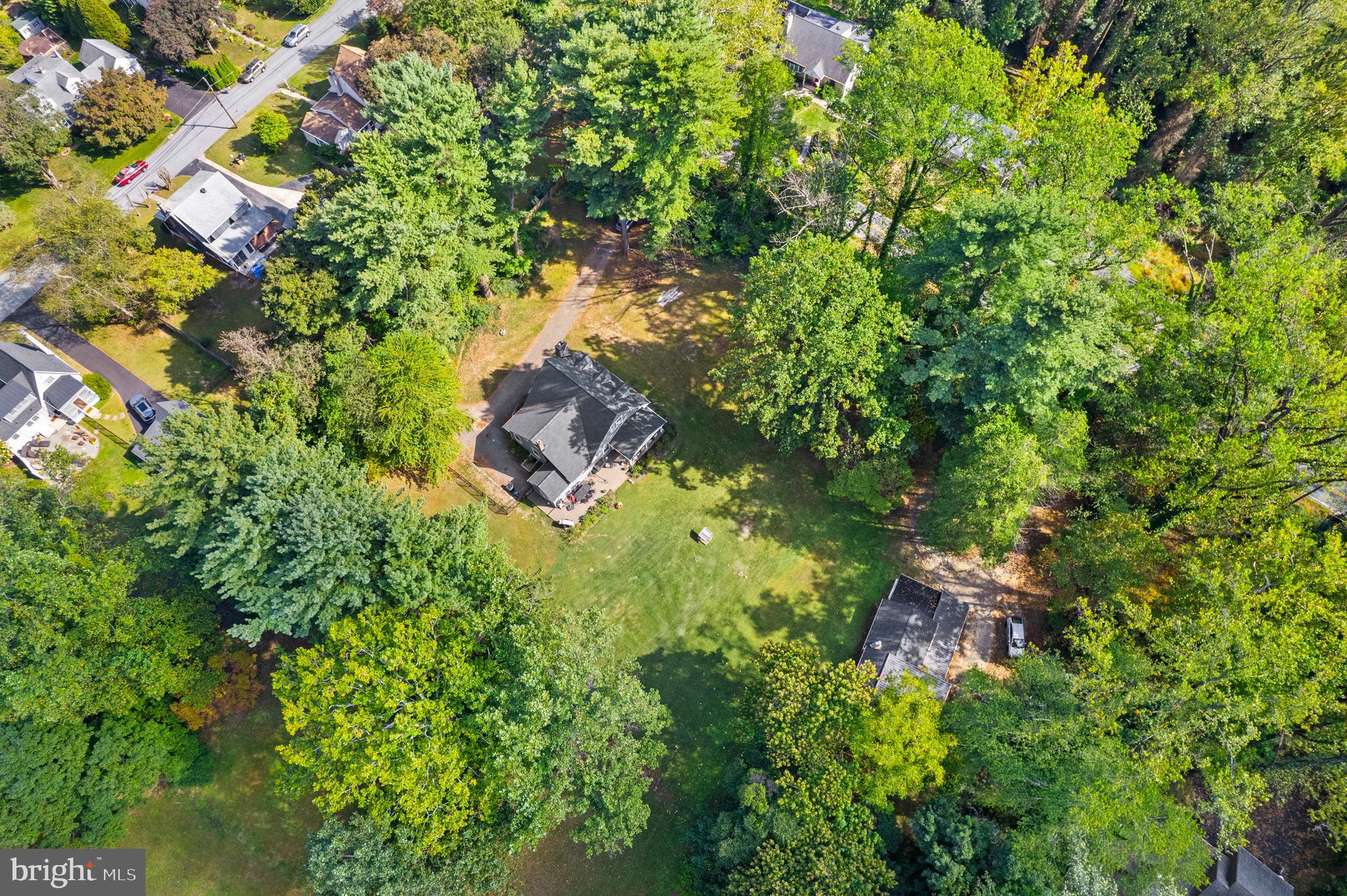 225 Fox Road Media, PA 19063 - Photo 9 of 12 a backyard of a house with lots of green space