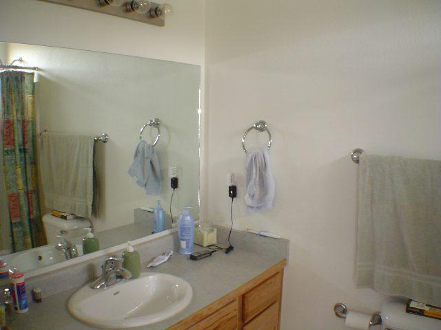 324 Evergreen Drive Rifle, CO 81650 - Photo 7 of 9 a bathroom with a sink and a mirror