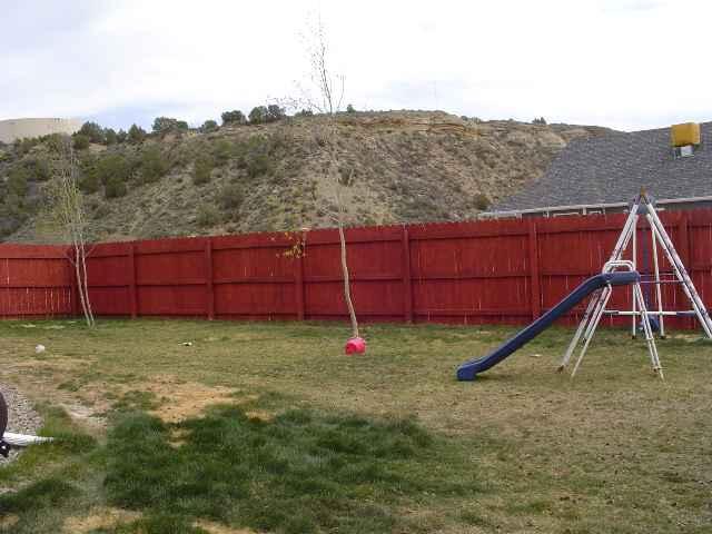 324 Evergreen Drive Rifle, CO 81650 - Photo 9 of 9 a backyard of a house with a yard