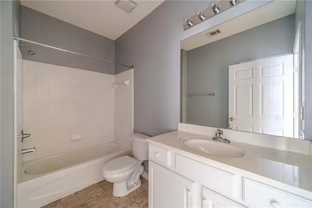 a view of a house with pool and chairs