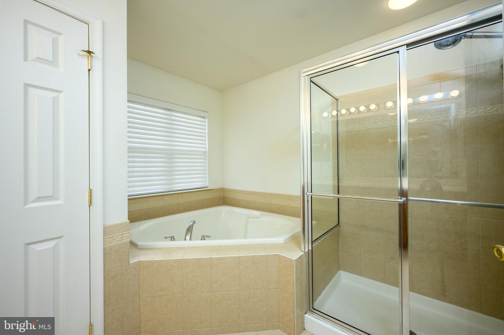 249 Concord Place Pennington, NJ 08534 - Photo 14 of 22 a bathroom with a bathtub and shower