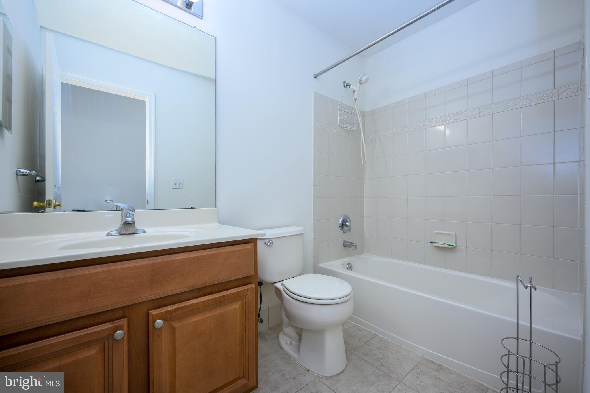 249 Concord Place Pennington, NJ 08534 - Photo 20 of 22 a bathroom with a sink a toilet and shower