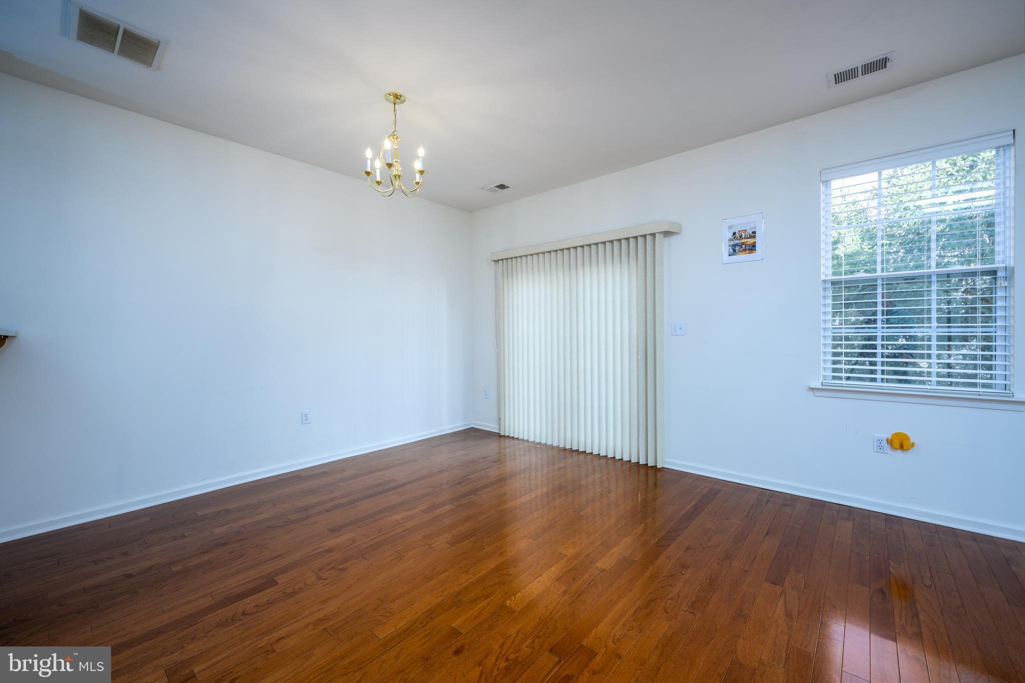 249 Concord Place Pennington, NJ 08534 - Photo 7 of 22 wooden floor in an empty room with a window