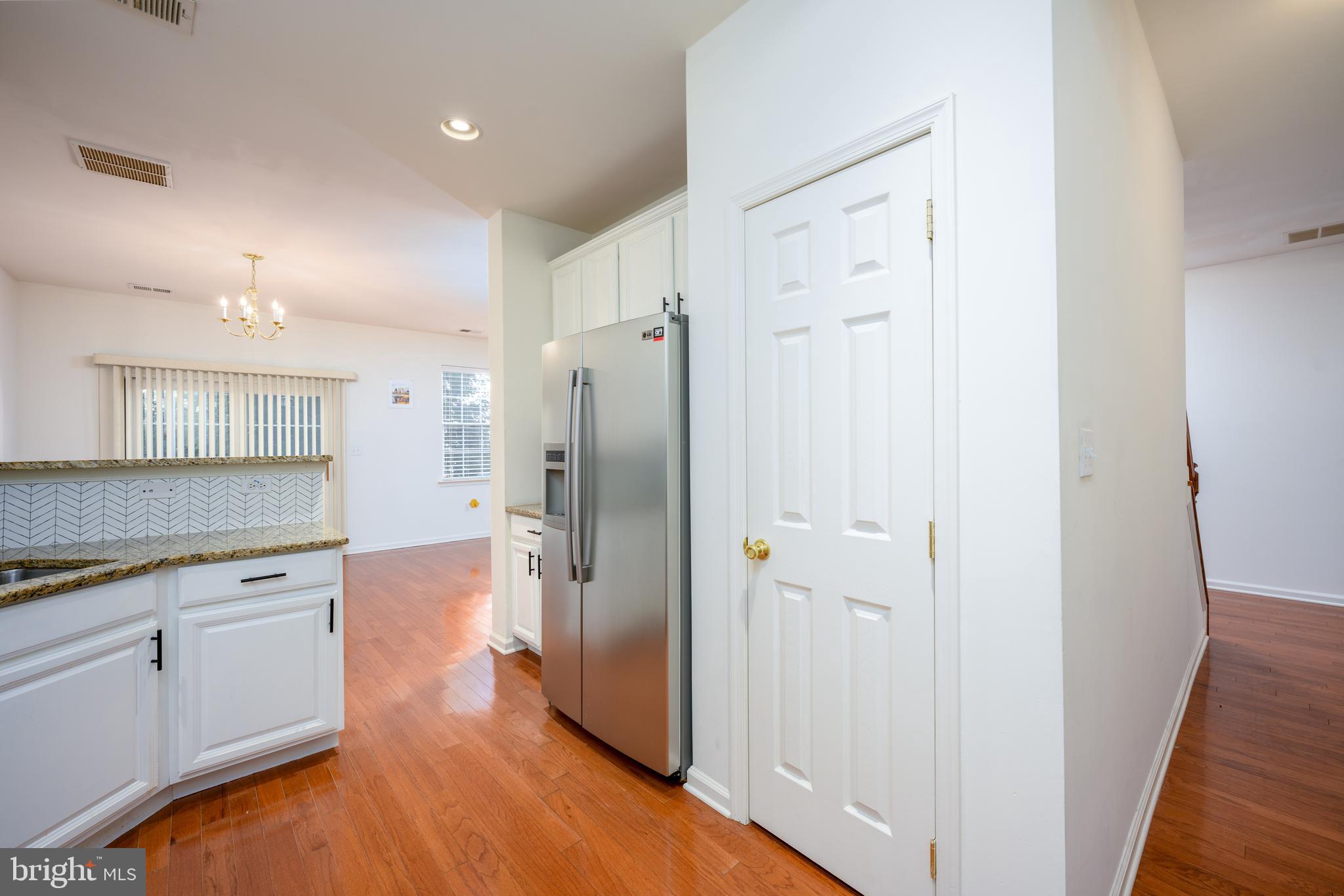 249 Concord Place Pennington, NJ 08534 - Photo 9 of 22 a view of a kitchen with a refrigerator and a sink
