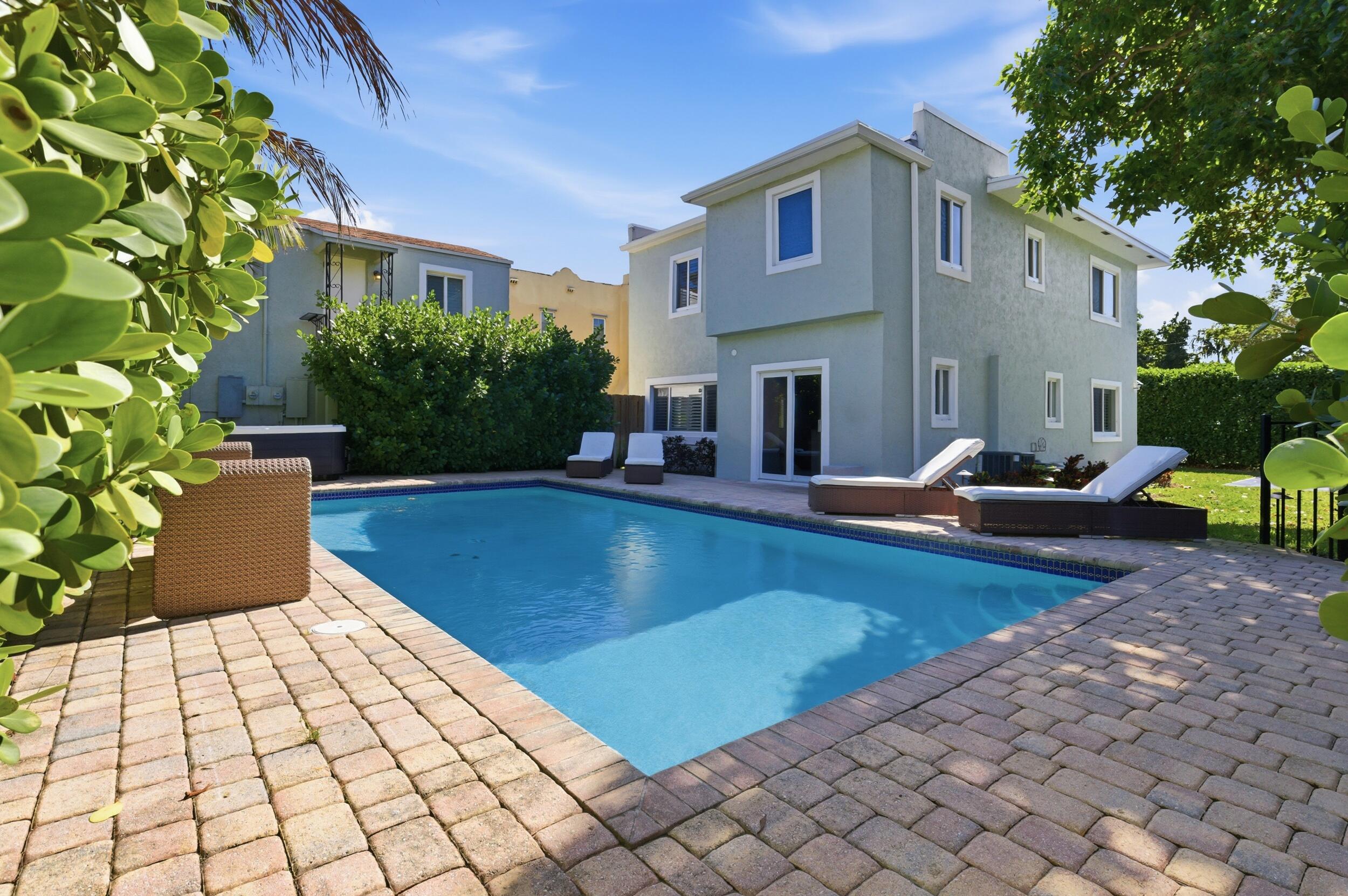 921 Ortega Road West Palm Beach, FL 33405 - Photo 3 of 60 a view of a house with swimming pool in front of it