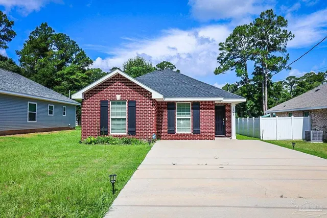 a front view of a house with yard