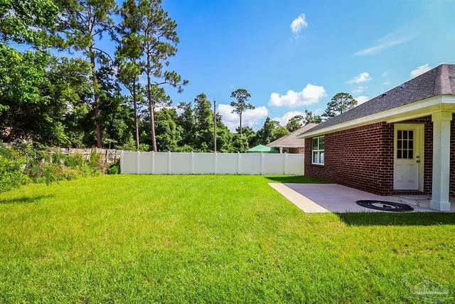 a view of yard with entertaining space