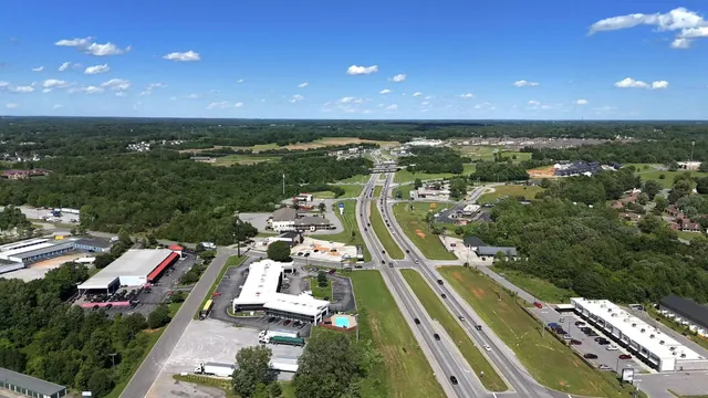 a view of a room with wooden shelves