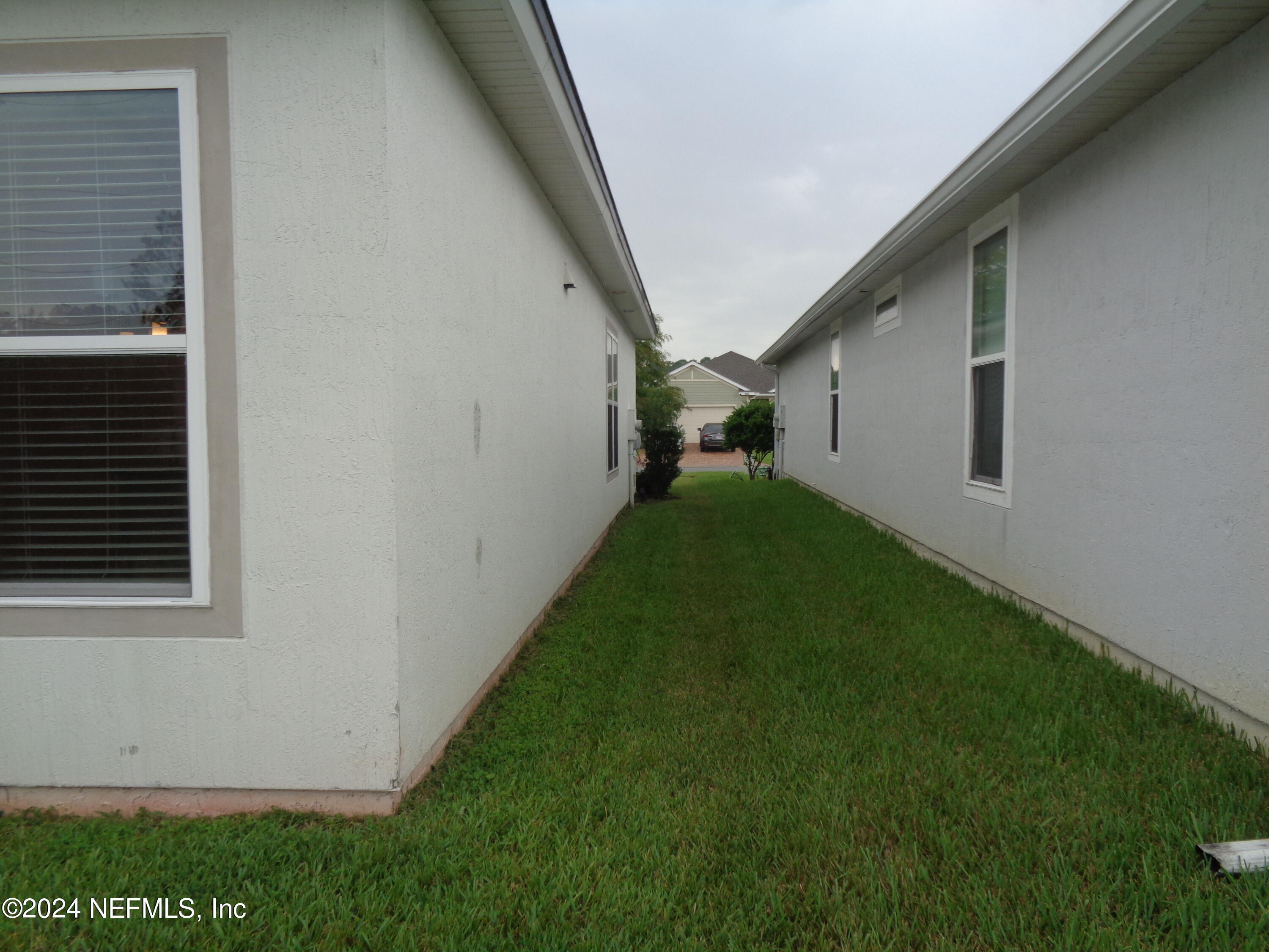 4055 Arbor Mill Circle Orange Park, FL 32065 - Photo 14 of 44 a backyard of a house with lots of green space