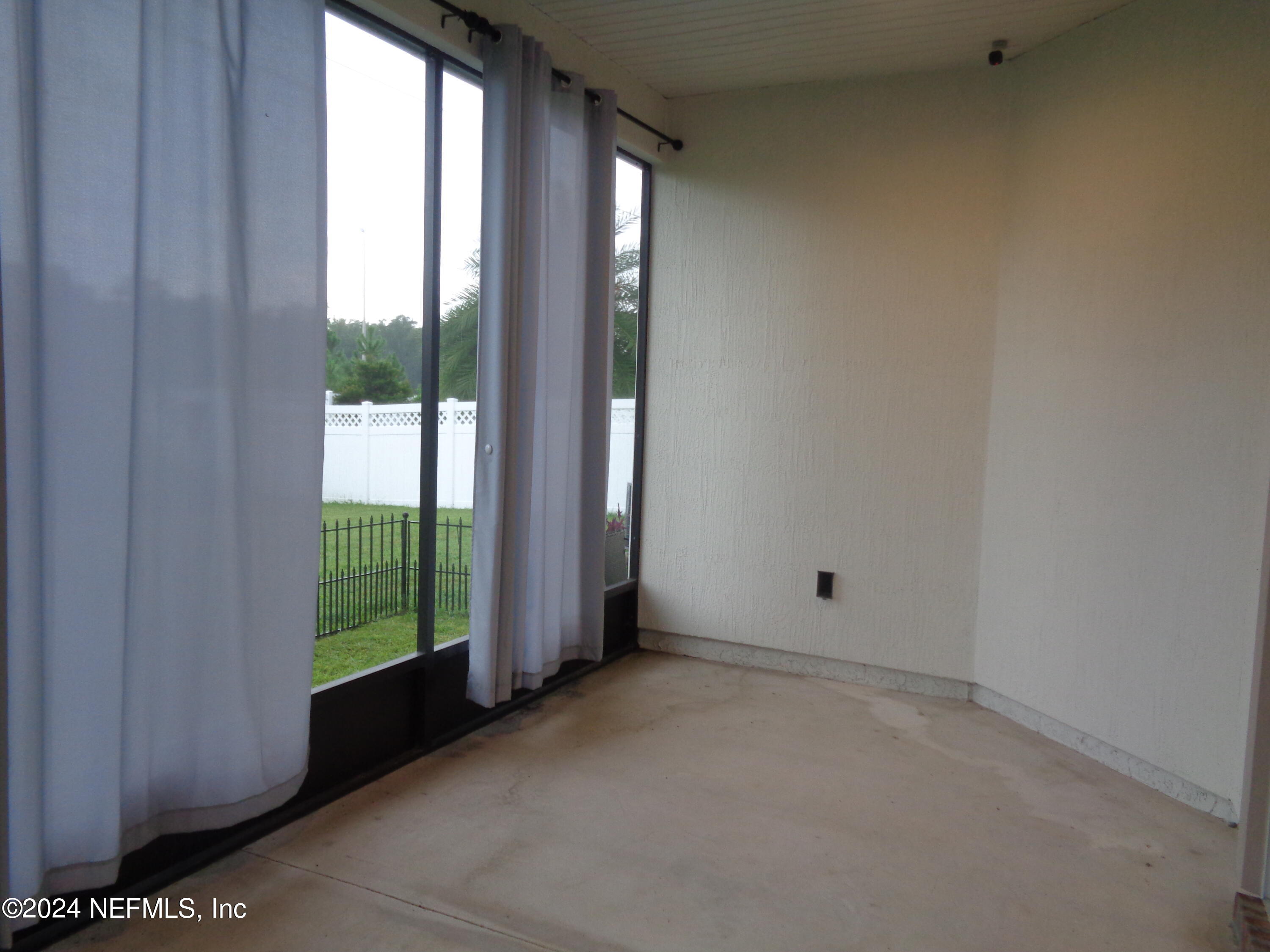 4055 Arbor Mill Circle Orange Park, FL 32065 - Photo 17 of 44 a view of an empty room with a window