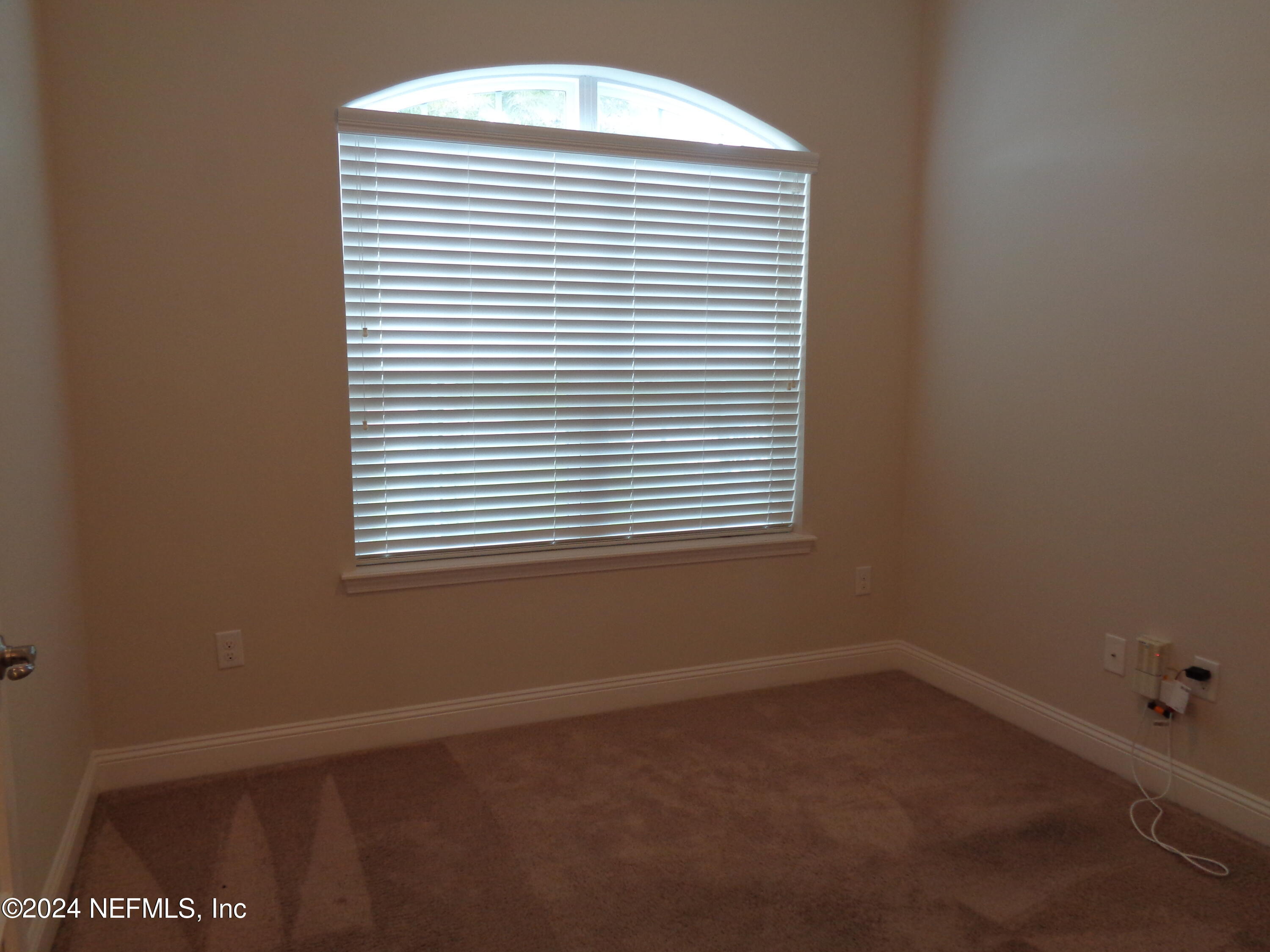 4055 Arbor Mill Circle Orange Park, FL 32065 - Photo 20 of 44 an empty room with a window