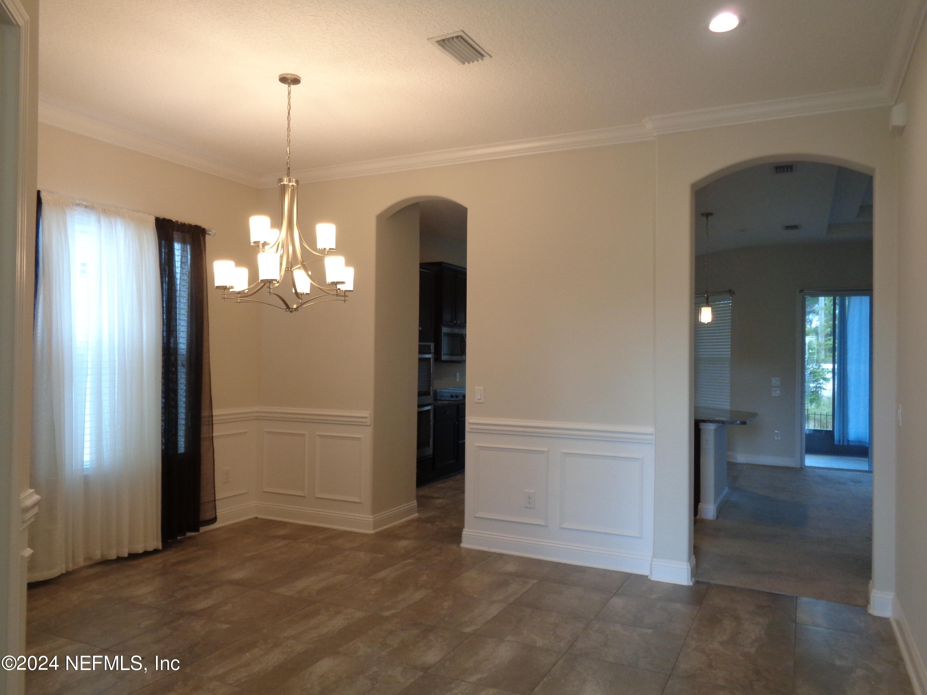 4055 Arbor Mill Circle Orange Park, FL 32065 - Photo 23 of 44 an empty room with closet and windows