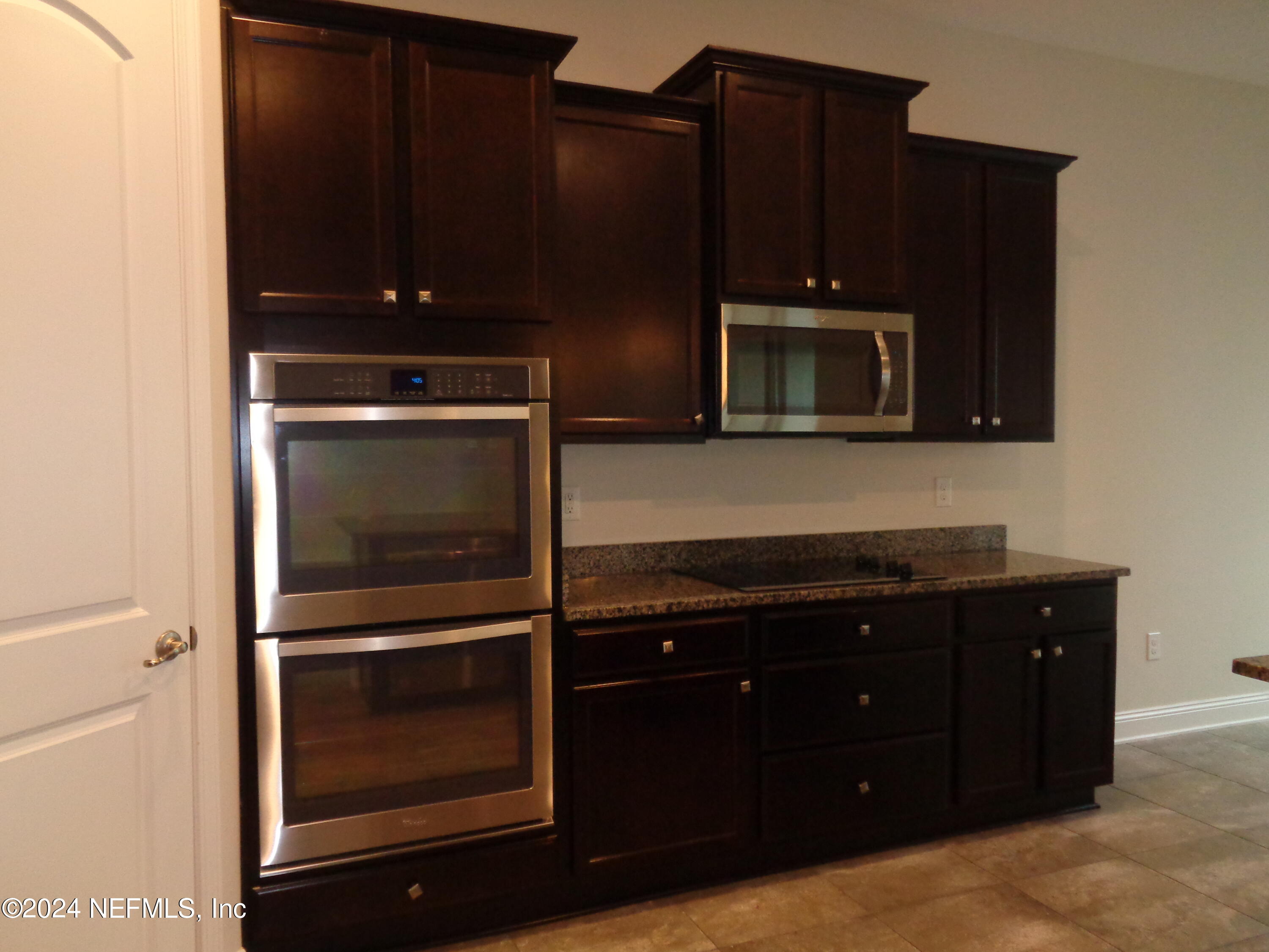 4055 Arbor Mill Circle Orange Park, FL 32065 - Photo 24 of 44 a kitchen with granite countertop stainless steel appliances and cabinets