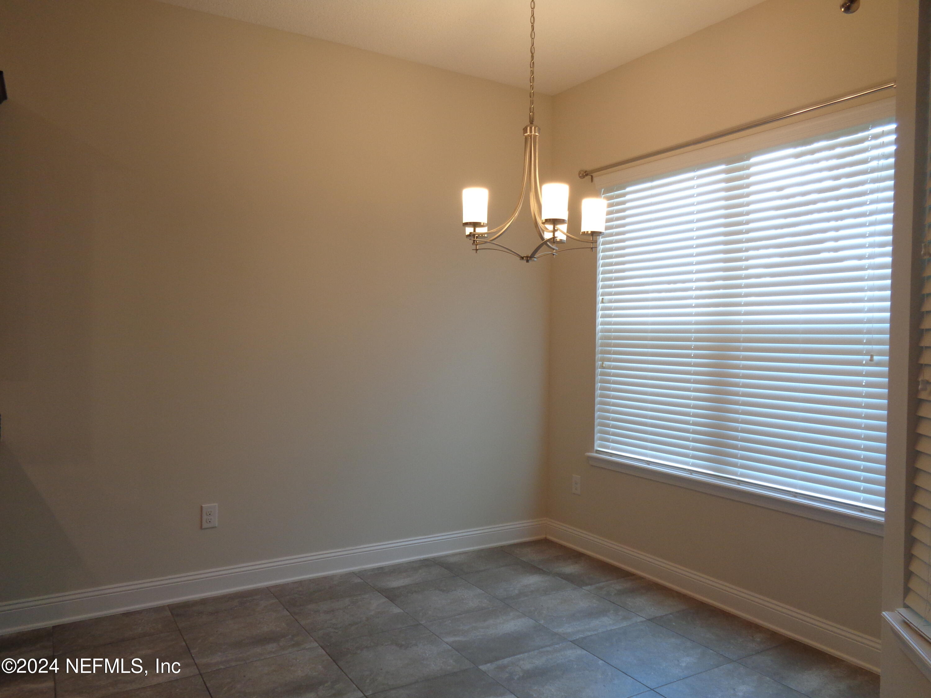 4055 Arbor Mill Circle Orange Park, FL 32065 - Photo 26 of 44 a view of an empty room with a window
