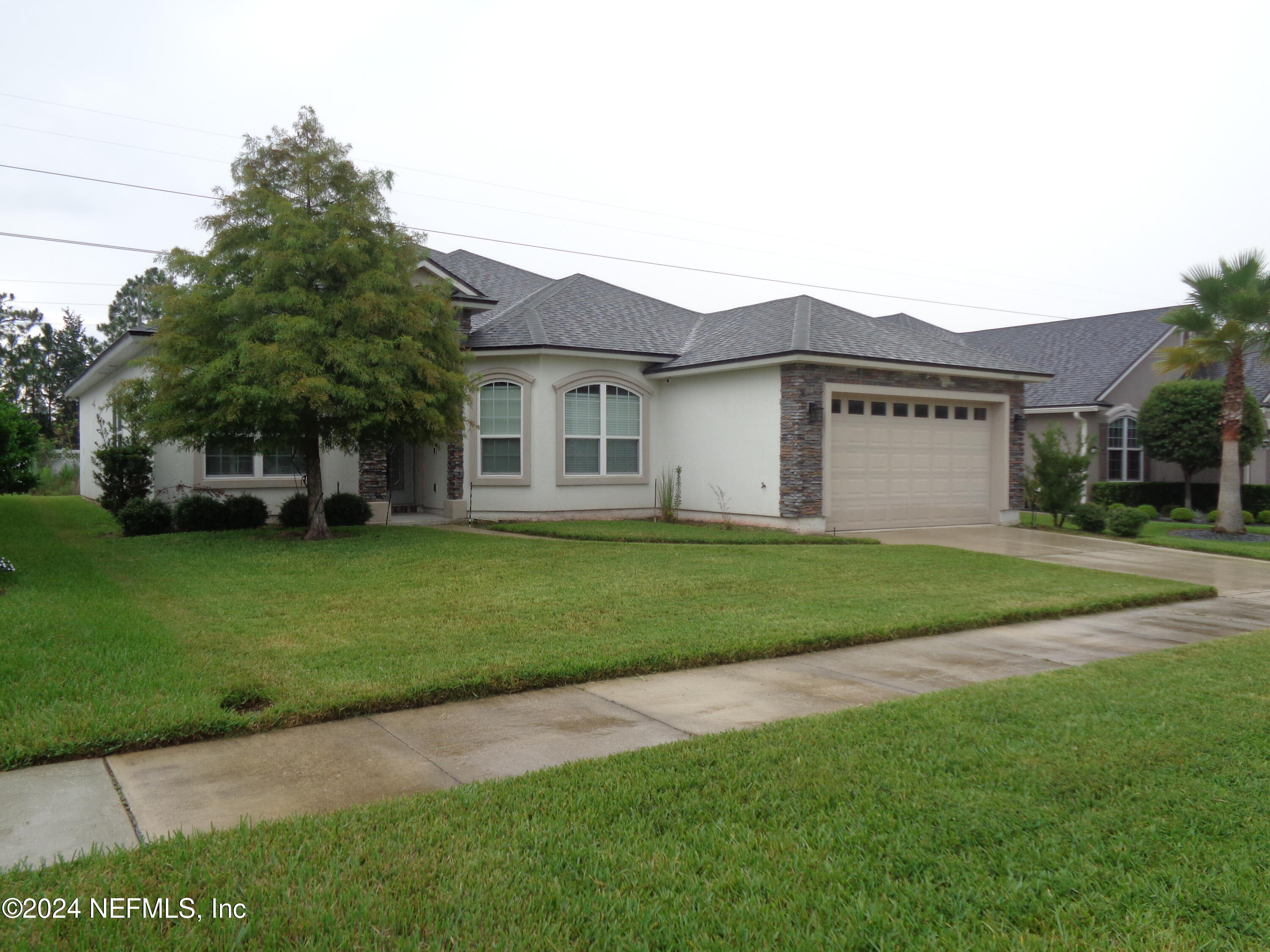 4055 Arbor Mill Circle Orange Park, FL 32065 - Photo 3 of 44 a view of house with a yard