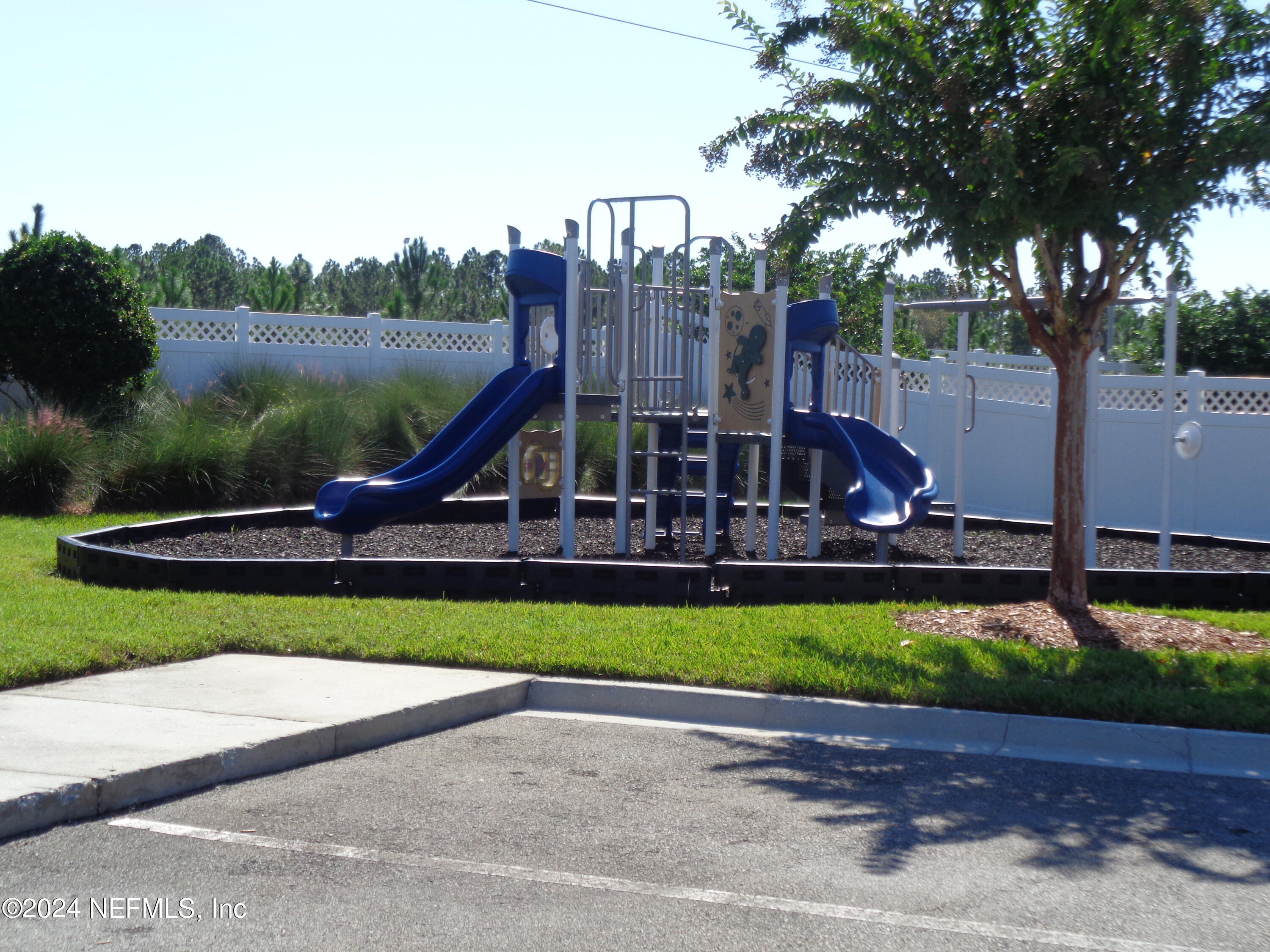 4055 Arbor Mill Circle Orange Park, FL 32065 - Photo 7 of 44 a view of a park with iron fence