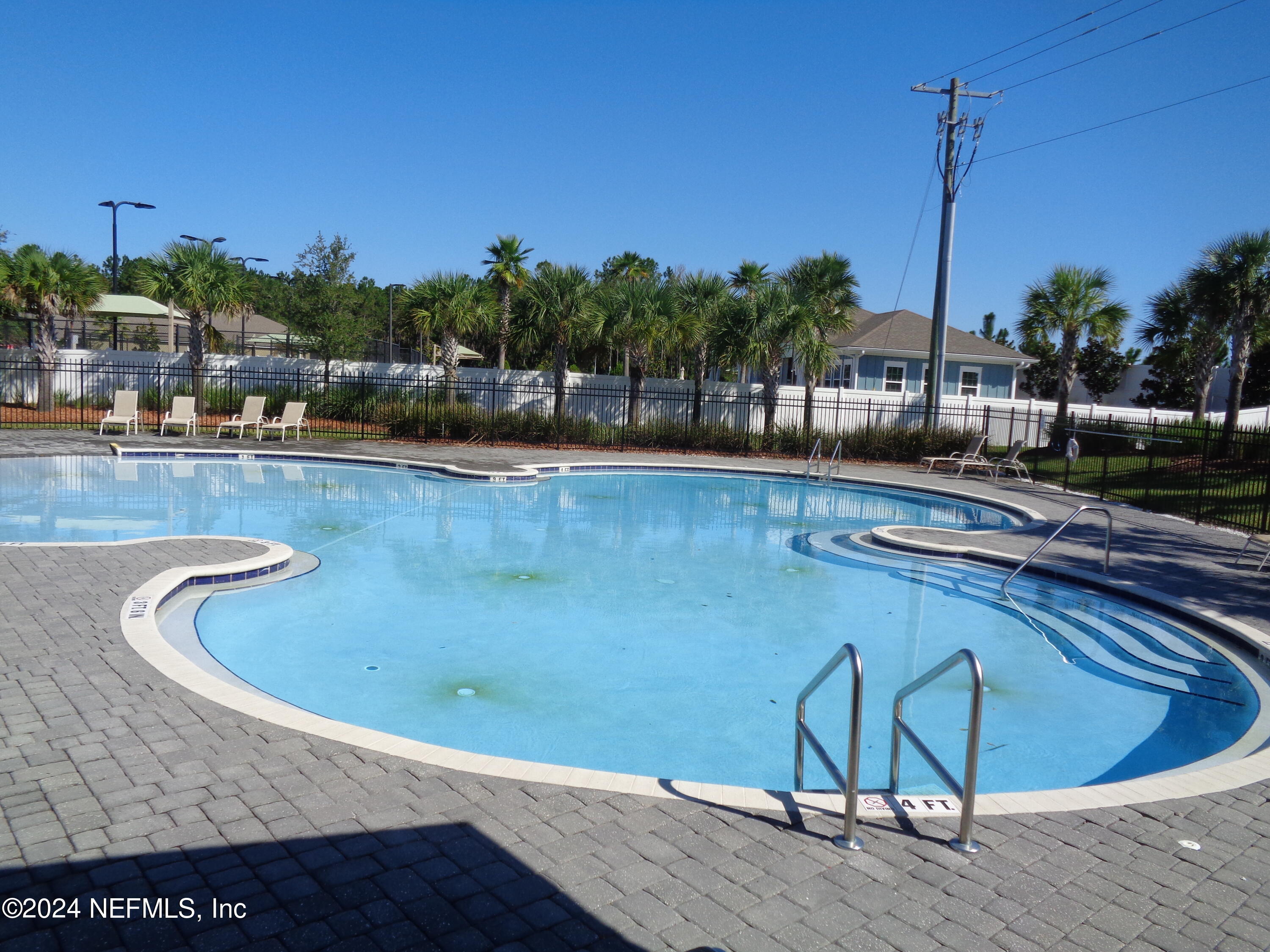 4055 Arbor Mill Circle Orange Park, FL 32065 - Photo 8 of 44 a view of a swimming pool with a sitting area