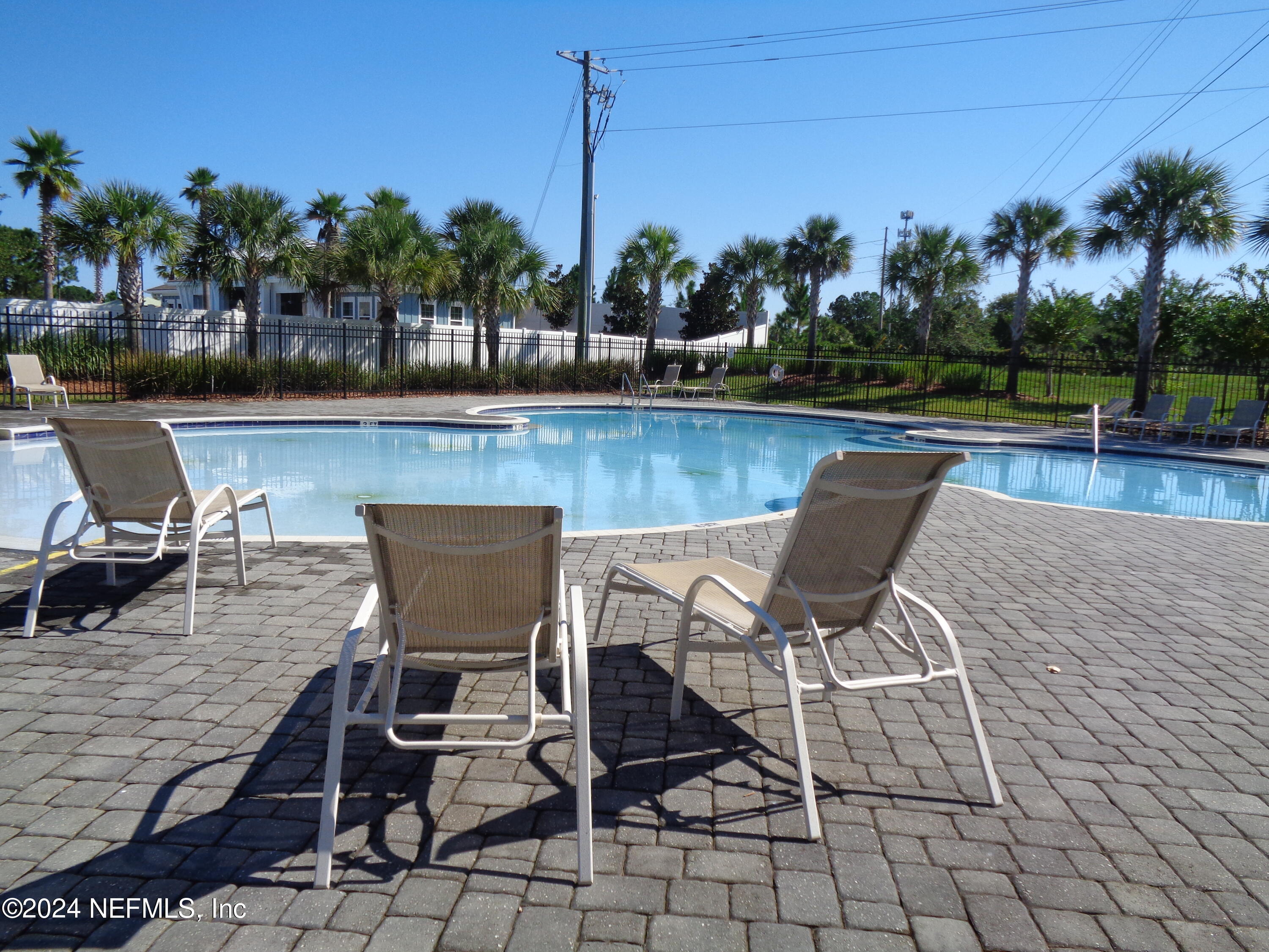 4055 Arbor Mill Circle Orange Park, FL 32065 - Photo 9 of 44 a view of a patio with chairs and table in the patio