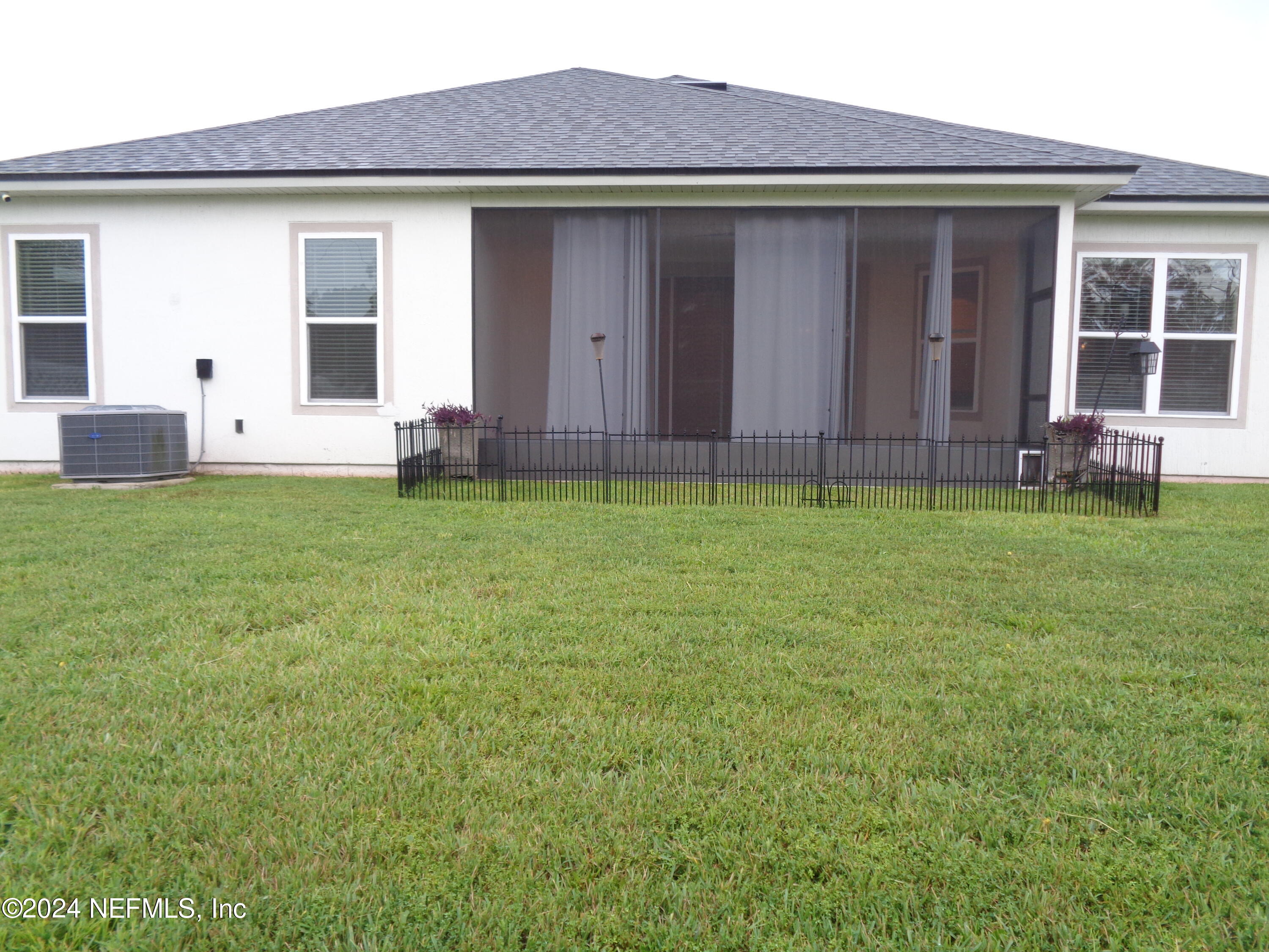 4055 Arbor Mill Circle Orange Park, FL 32065 - Photo 10 of 44 a house view with a garden space