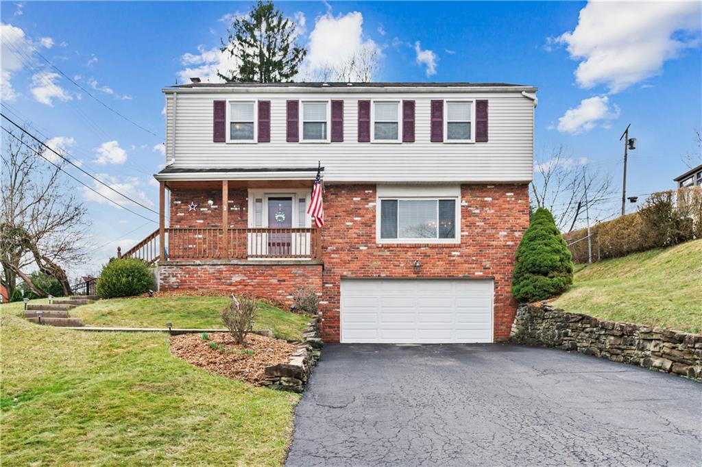 5140 Raintree Drive Pittsburgh, PA 15236 - Photo 1 of 26 a front view of a house with a yard