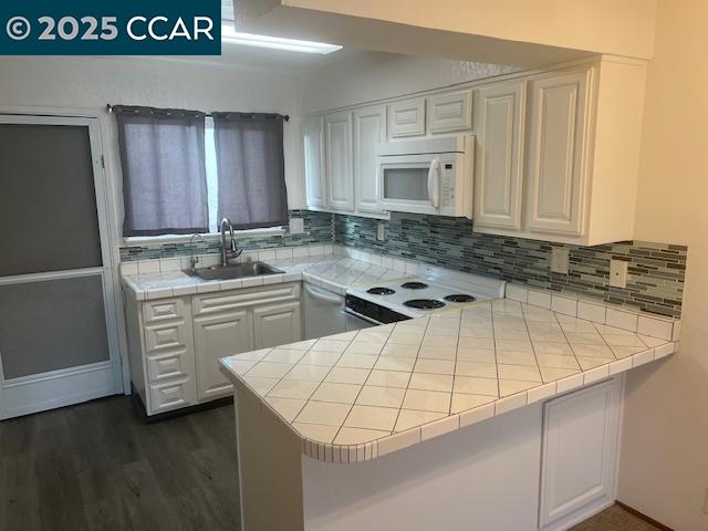 1851 Harrison Street, Unit 15 Concord, CA 94520 - Photo 15 of 41 a kitchen with a sink a stove and cabinets