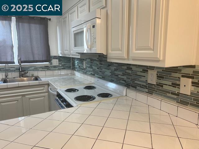 1851 Harrison Street, Unit 15 Concord, CA 94520 - Photo 16 of 41 a kitchen with a sink and cabinets