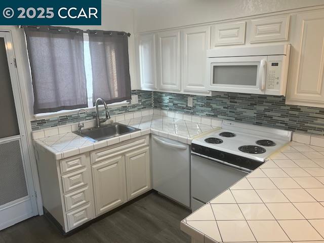 1851 Harrison Street, Unit 15 Concord, CA 94520 - Photo 17 of 41 a kitchen with a sink cabinets and wooden floor