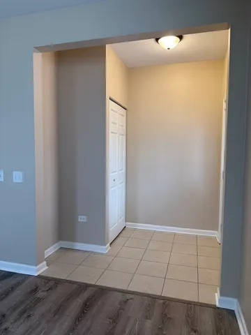 an empty room with wooden floor