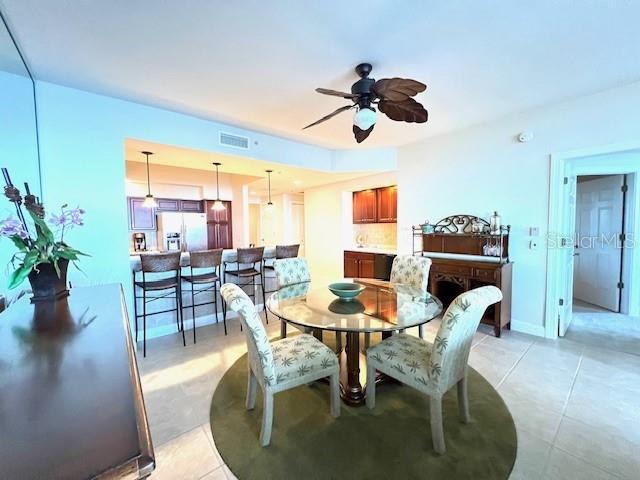 3321 Sunset Key Circle, Unit 502 Punta Gorda, FL 33955 - Photo 13 of 53 a view of a dining room with furniture and a potted plant