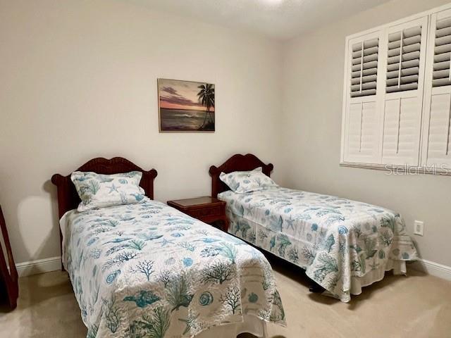 3321 Sunset Key Circle, Unit 502 Punta Gorda, FL 33955 - Photo 18 of 53 a bedroom with two beds and a window