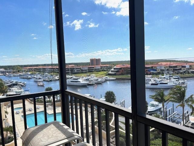 3321 Sunset Key Circle, Unit 502 Punta Gorda, FL 33955 - Photo 7 of 53 a view of a balcony with wooden floor and lake view