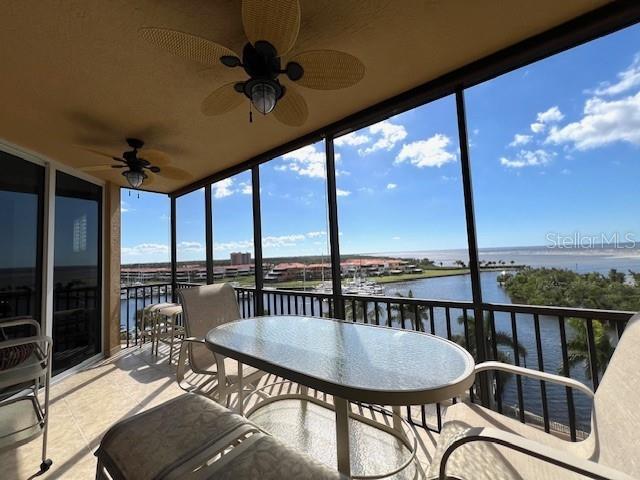 3321 Sunset Key Circle, Unit 502 Punta Gorda, FL 33955 - Photo 9 of 53 a roof deck with table and chairs