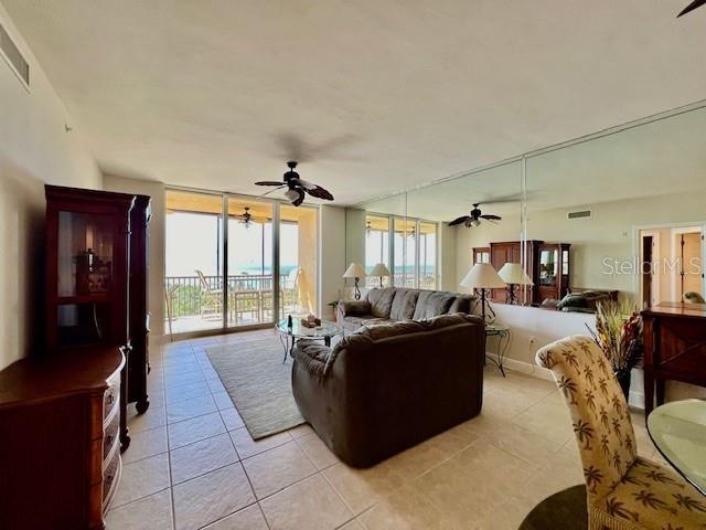 3321 Sunset Key Circle, Unit 502 Punta Gorda, FL 33955 - Photo 10 of 53 a living room with furniture and a large window