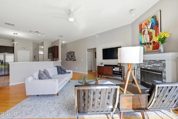 a living room with furniture and a flat screen tv